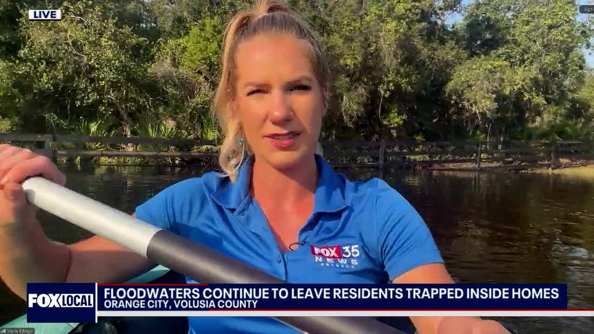 Tractor or kayak? Flood blocks Orange City neighborhood